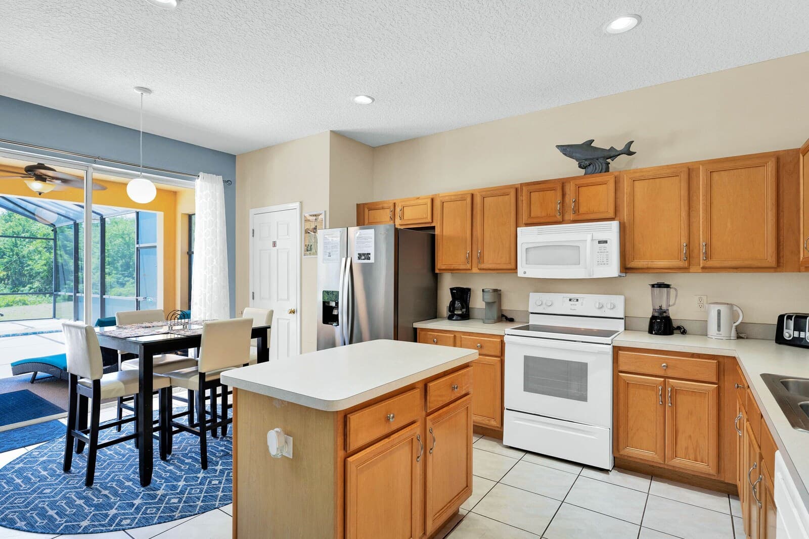 Full kitchen with island and wood cabinets